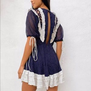 spot printed mini dress with satin trim ruffle and tie detail